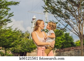 Mom and son on background of Fort Cornwallis in Georgetown, Penang, is a star fort built by the British East India Company in the late 18th century, it is the largest standing fort in Malaysia. Traveling with children concept