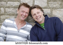 A happy gay couple laughing. A happy gay couple laughing.