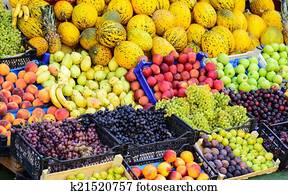 Market with various colorful fresh fruits and vegetables