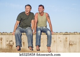 A happy laughing gay couple A happy laughing gay couple