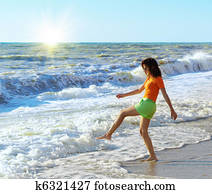 Girl play on the beach