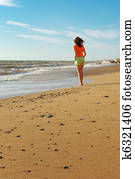 Girl walking on the beach