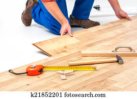 Man laying laminate flooring Man laying laminate flooring