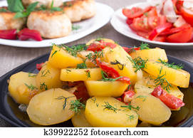 Stewed potatoes with bell pepper closeup