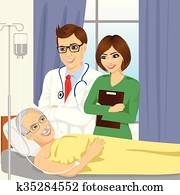 young male doctor and nurse visiting a senior old man patient