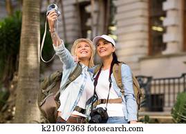 tourists taking self portrait 