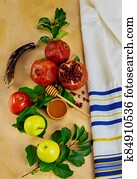 Yom Kippur concept. Fruits with honey and jewish tallit. Yom Kippur concept. Fruits with honey and jewish tallit.
