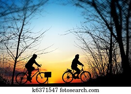 Cycling trip at sunset