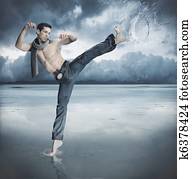 Taekwondo fighter training in the nature