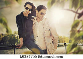 Attractive young couple wearing sunglasses