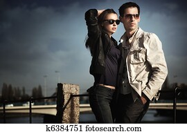 Attractive young couple wearing sunglasses
