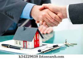 Handshakes with customer after contract signature