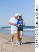 Healthy Senior Couple Running Jogging on Beach