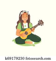 um, haired longo, mulher, ou, um, jovem, mulher bonita, senta-se, grama, e, jogos, a, guitar.