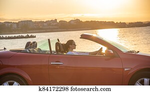 Red car on the beach. Red car on the beach.