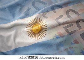 colorful waving national flag of argentina on a euro money banknotes background. finance concept