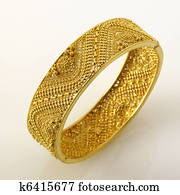 Fine Jewelry gold cuff bracelet isolated on white