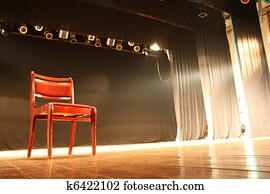 Chair on empty theatre stage