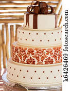 Layered white wedding cake with chocolate detail