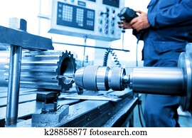 Man operating CNC drilling and boring machine. Industry Man operating CNC drilling and boring machine. Industry