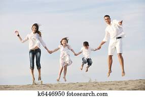 happy young family have fun on beach happy young family have fun on beach