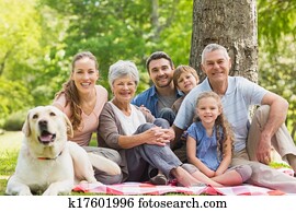 Extended family with their pet dog Extended family with their pet dog