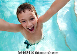Joyful kid in a swimming pool Joyful kid in a swimming pool