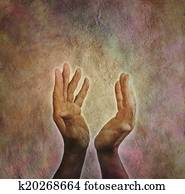 Male hands outstretched with parchm