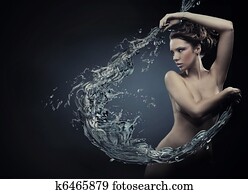 Young beauty dancing with water splash Young beauty dancing with water splash