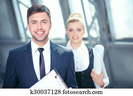 Attractive young business partners are discussing new project