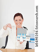 Young pretty red-haired woman in suit 