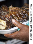 Baked tilapia served with red pepper sauce