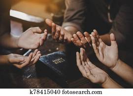 Group of different women praying together Group of different women praying together