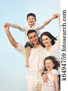 happy young family have fun on beach happy young family have fun on beach