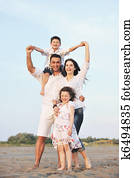 happy young family have fun on beach