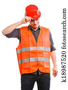 Man worker in safety vest and hard hat. Safety in work.