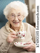 Senior Woman Enjoying Cup Of Tea At Home