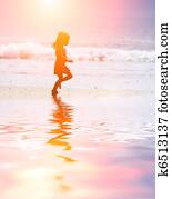 Child running at beach