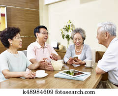 two-senior-asian-couple-chatting-stock-photograph__k48984609.jpg