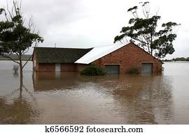 Flooded House on River Bank Flooded House on River Bank