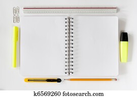 Open notebook with stationaries