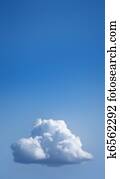 Single white cloud in blue sky