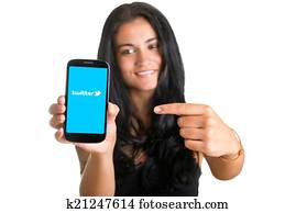 Woman Pointing at a Mobile Phone Woman Pointing at a Mobile Phone
