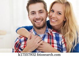 Close up happy embraced couple