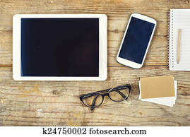 Desktop mix on a wooden office table.