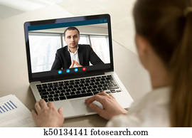 Businesswoman calling businessman online by video chat pc app, c Businesswoman calling businessman online by video chat pc app, c