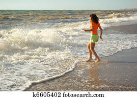 Girl play on the beach