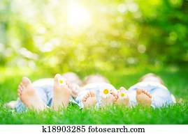 Family lying on grass Family lying on grass