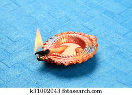 Hindu Festival Diwali Diya on Blue Background Hindu Festival Diwali Diya on Blue Background