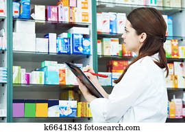 Pharmacy chemist woman in drugstore